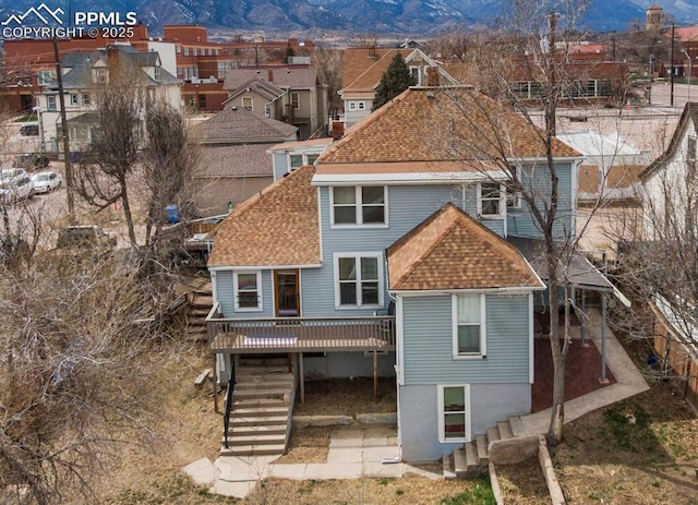 322 Platte Ct, Colorado Springs, CO 80903 - rear view of property featuring a deck with mountain view, roof with shingles, stairs, a residential view, and a patio area