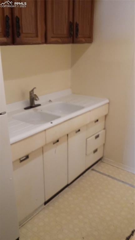 322 Platte Ct, Colorado Springs, CO 80903 - clothes washing area with a sink and baseboards