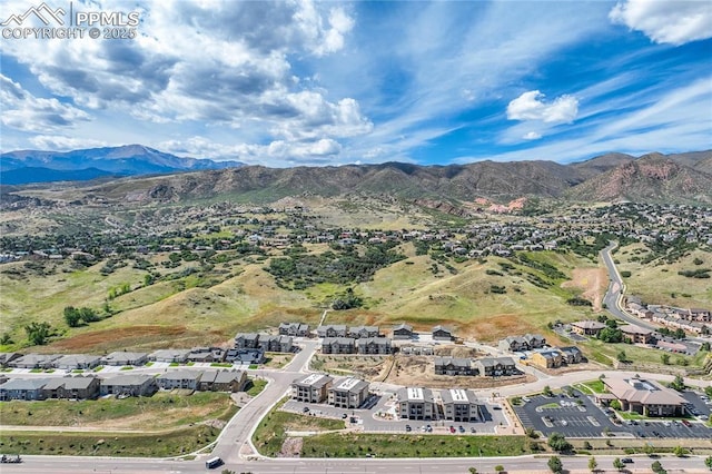 drone / aerial view featuring a residential view and a mountain view