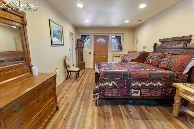 bedroom with recessed lighting, baseboards, and light wood finished floors