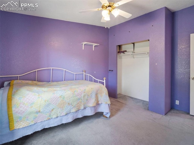 bedroom with a closet, ceiling fan, and carpet flooring