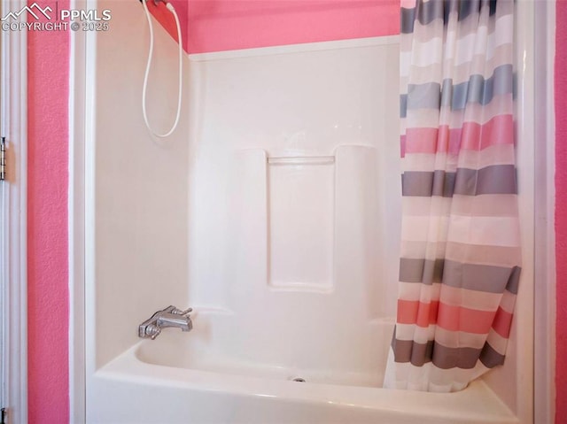 bathroom featuring shower / tub combo with curtain