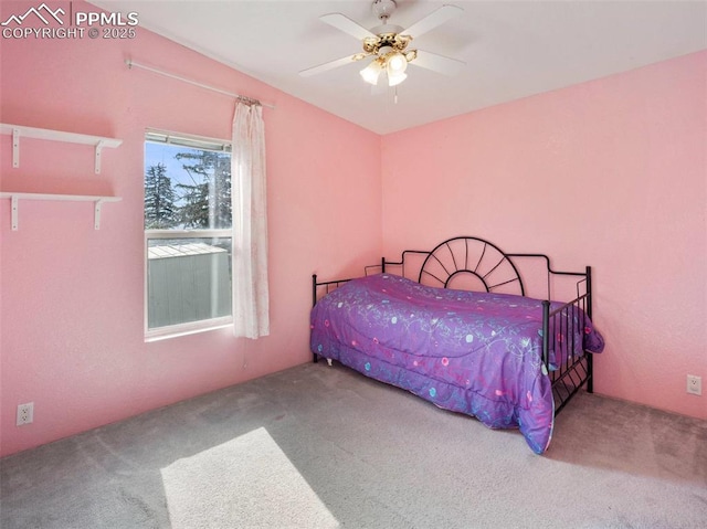 carpeted bedroom featuring a ceiling fan