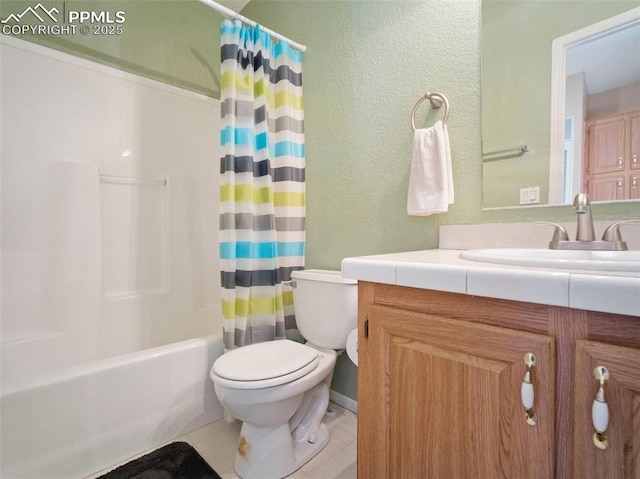 bathroom featuring a textured wall, vanity, toilet, tile patterned floors, and shower / bath combo with shower curtain
