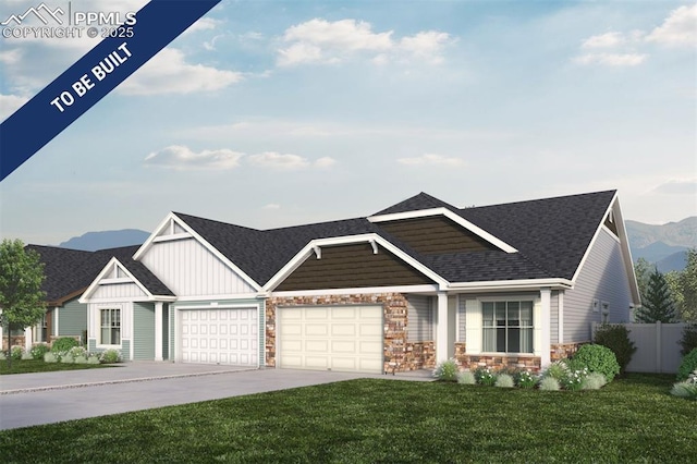 craftsman-style home with fence, an attached garage, board and batten siding, a front yard, and driveway