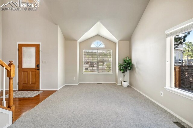 7665 Calloway Ct, Colorado Springs, CO 80919 - entryway with carpet flooring, lofted ceiling, baseboards, and stairs