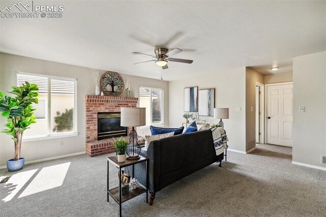 7665 Calloway Ct, Colorado Springs, CO 80919 - carpeted living room with a ceiling fan, baseboards, and a fireplace