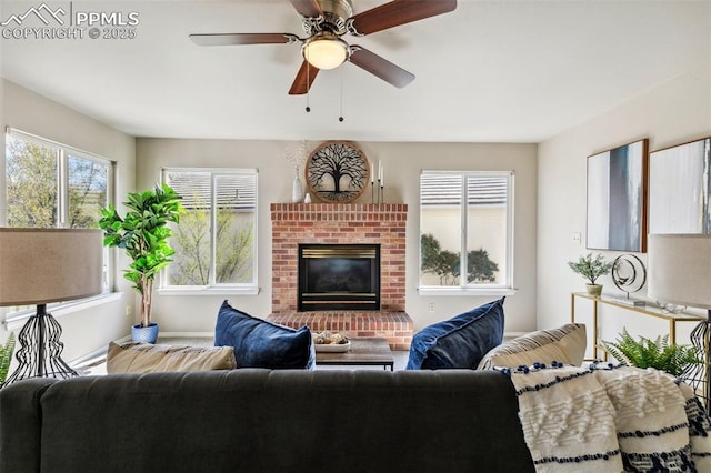 7665 Calloway Ct, Colorado Springs, CO 80919 - living area featuring a brick fireplace and ceiling fan