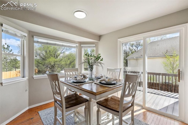 7665 Calloway Ct, Colorado Springs, CO 80919 - dining space with baseboards, light wood-type flooring, and plenty of natural light