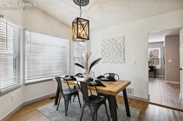 8365 Pepperridge Dr, Colorado Springs, CO 80920 - dining space with a textured ceiling, baseboards, and light wood-type flooring