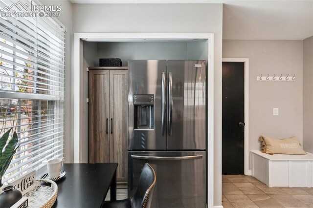 8365 Pepperridge Dr, Colorado Springs, CO 80920 - kitchen featuring stainless steel fridge and light tile patterned floors