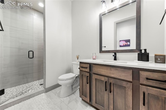 bathroom featuring vanity, a stall shower, toilet, and marble finish floor