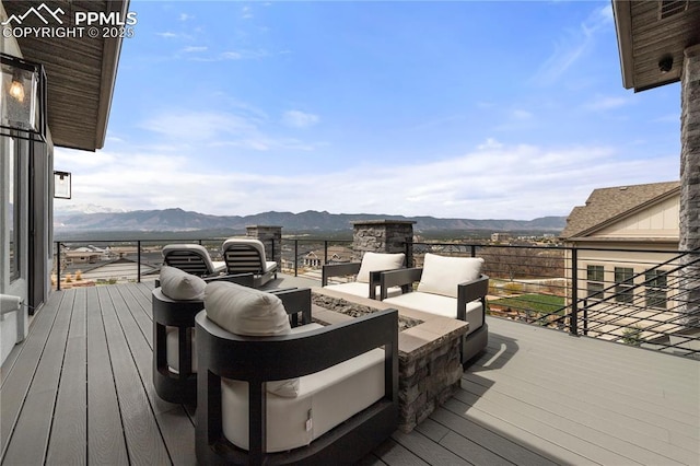 wooden deck with a mountain view