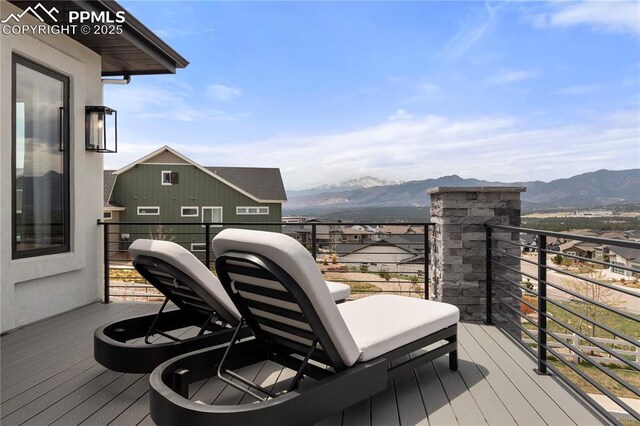 wooden terrace featuring a mountain view