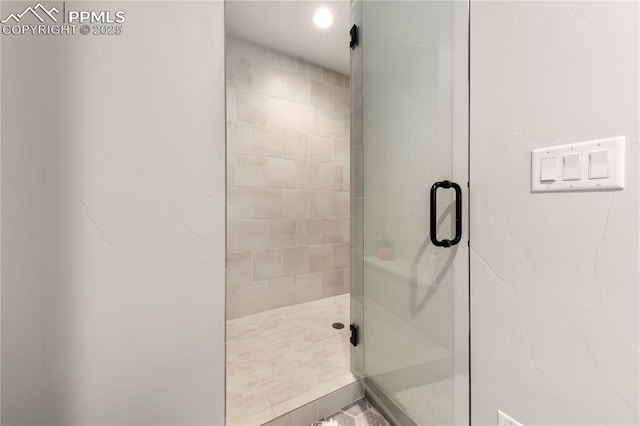 full bath featuring a shower stall