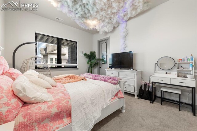 bedroom featuring light colored carpet and visible vents
