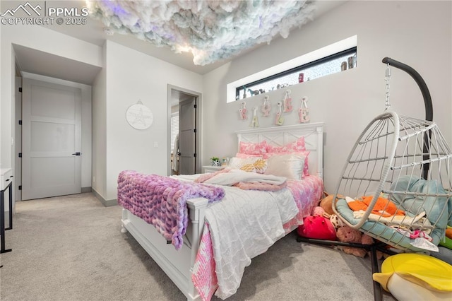 bedroom featuring carpet floors and baseboards