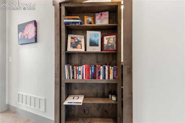 details featuring visible vents and wood finished floors
