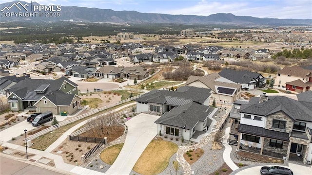 bird's eye view with a residential view and a mountain view