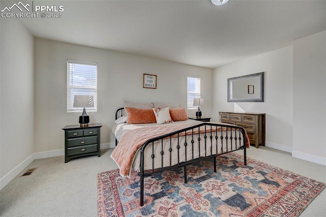 9773 Marble Canyon Way, Peyton, CO 80831 - bedroom with multiple windows, carpet floors, and baseboards