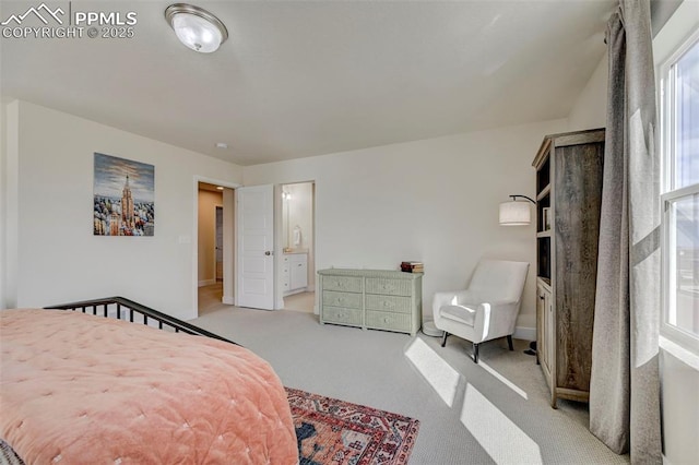 9773 Marble Canyon Way, Peyton, CO 80831 - bedroom featuring light carpet, ensuite bath, and baseboards