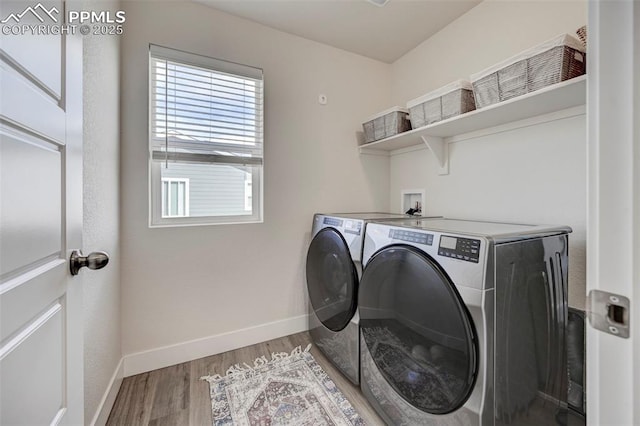 9773 Marble Canyon Way, Peyton, CO 80831 - laundry area featuring independent washer and dryer, healthy amount of natural light, baseboards, and light wood finished floors