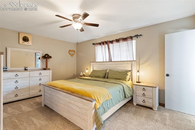 bedroom with a ceiling fan and light carpet