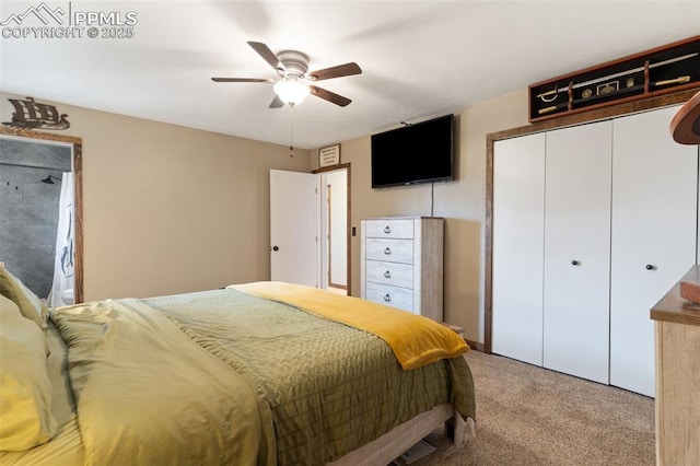 carpeted bedroom featuring ceiling fan and a closet