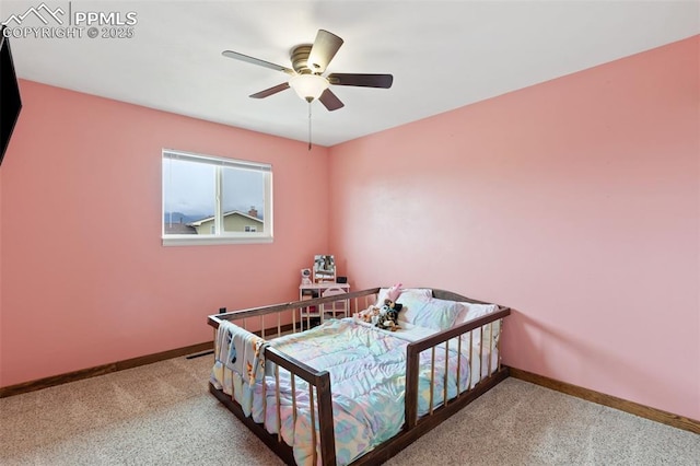 carpeted bedroom with baseboards and a ceiling fan