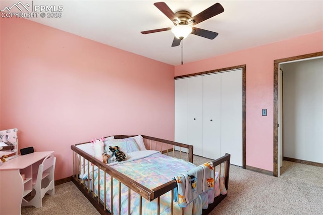 carpeted bedroom featuring baseboards, ceiling fan, and a closet