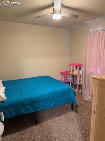 6290 Pilgrimage Rd, Colorado Springs, CO 80925 - carpeted bedroom with ceiling fan