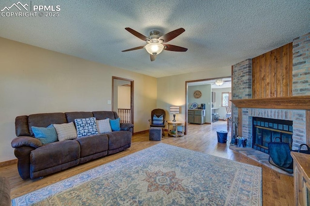 17815 Fairplay Way, Monument, CO 80132 - living area featuring a textured ceiling, ceiling fan, and wood finished floors