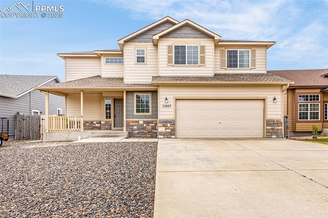 craftsman inspired home featuring fence, stone siding, a garage, a porch, and concrete driveway