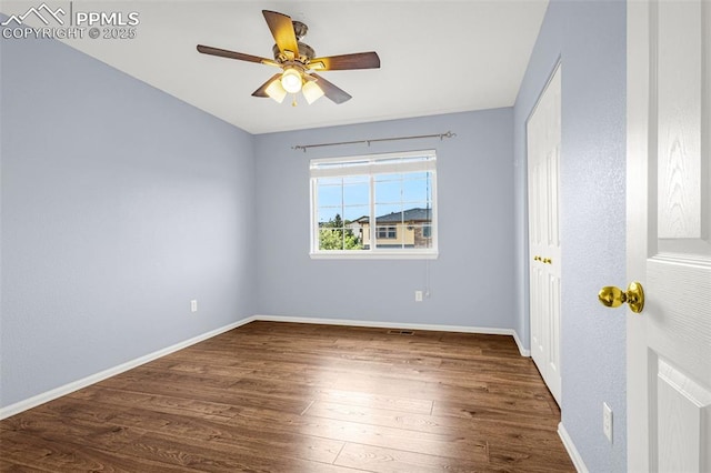 unfurnished bedroom featuring baseboards, a ceiling fan, and wood finished floors