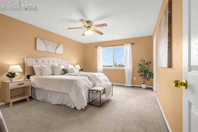 bedroom featuring baseboards, light carpet, and ceiling fan