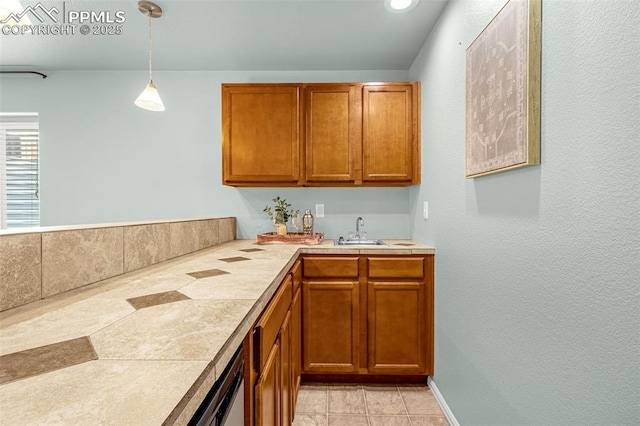 interior space featuring a sink, wet bar, light tile patterned flooring, and decorative light fixtures