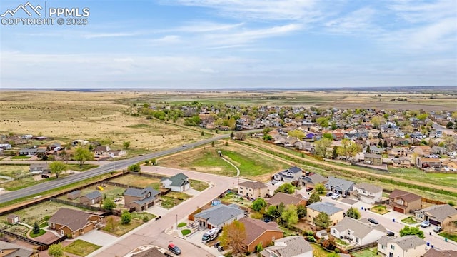 birds eye view of property with a residential view