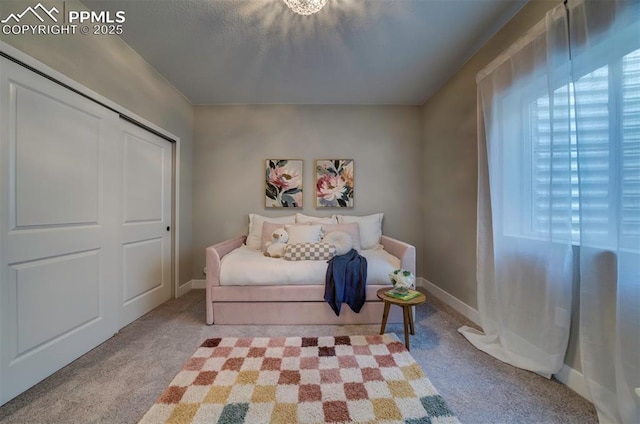 sitting room with carpet flooring and baseboards