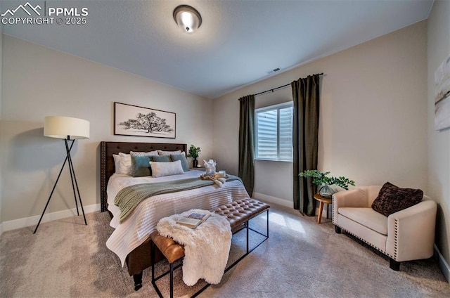 carpeted bedroom featuring baseboards