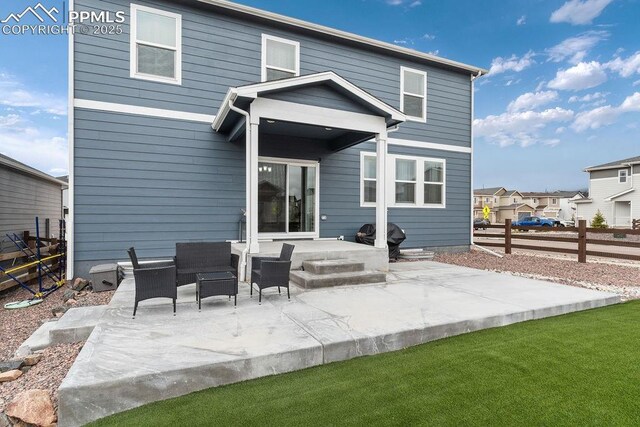 2186 Prairie Smoke Dr, Monument, CO 80132 - rear view of house with fence, a residential view, outdoor lounge area, and a patio area