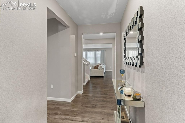 2186 Prairie Smoke Dr, Monument, CO 80132 - corridor featuring baseboards, a textured wall, and wood finished floors