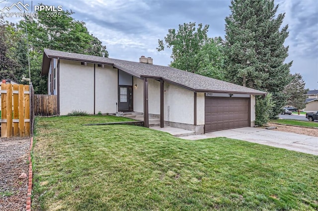 2903 E Serendipity Cir, Colorado Springs, CO 80917 - mid-century inspired home featuring an attached garage, driveway, a chimney, and stucco siding