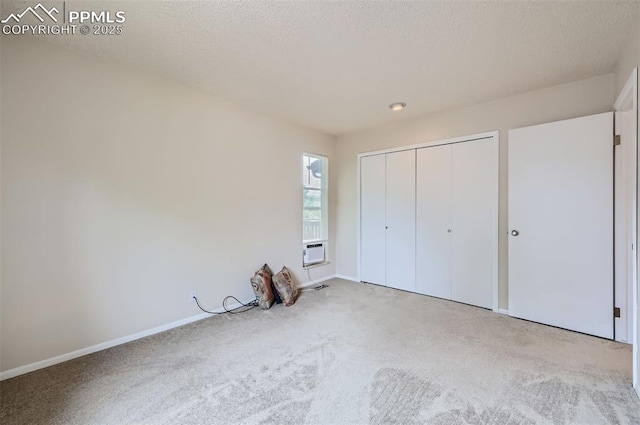 2903 E Serendipity Cir, Colorado Springs, CO 80917 - unfurnished bedroom with carpet floors, baseboards, a closet, a textured ceiling, and cooling unit