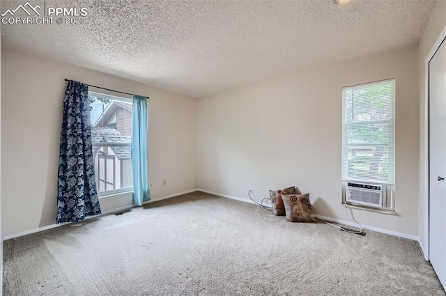 2903 E Serendipity Cir, Colorado Springs, CO 80917 - carpeted empty room featuring plenty of natural light, cooling unit, a textured ceiling, and baseboards