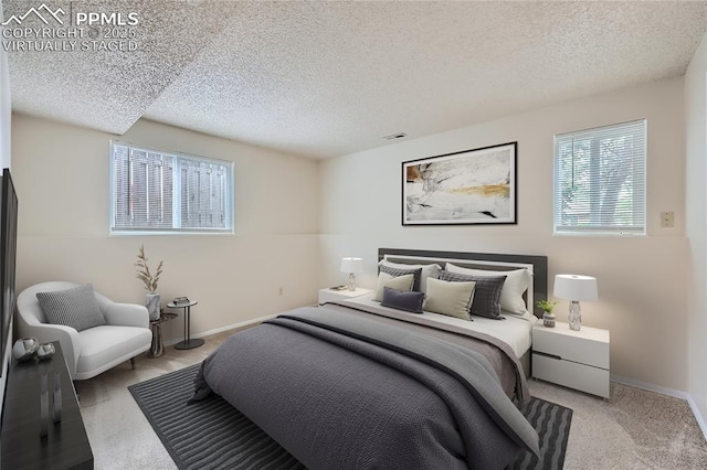 2903 E Serendipity Cir, Colorado Springs, CO 80917 - bedroom featuring a textured ceiling, baseboards, and carpet flooring