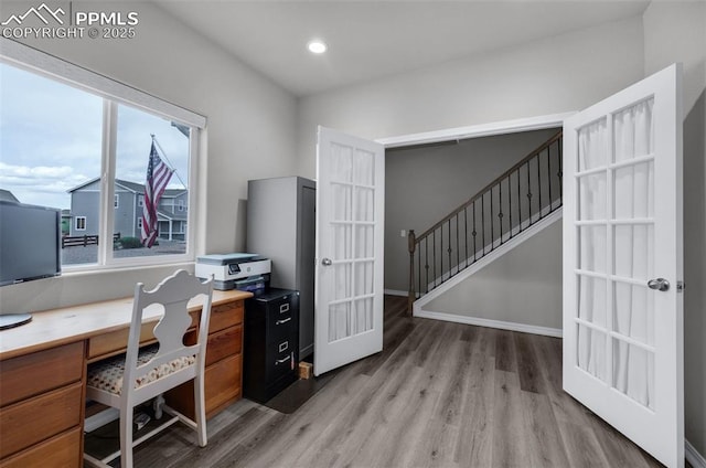home office with recessed lighting, baseboards, french doors, and light wood-style floors