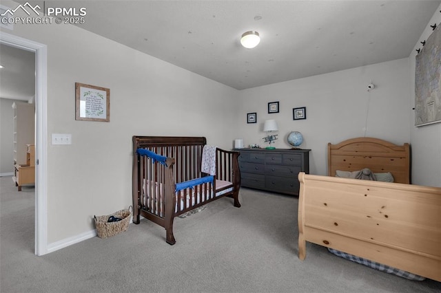 bedroom with carpet flooring and baseboards