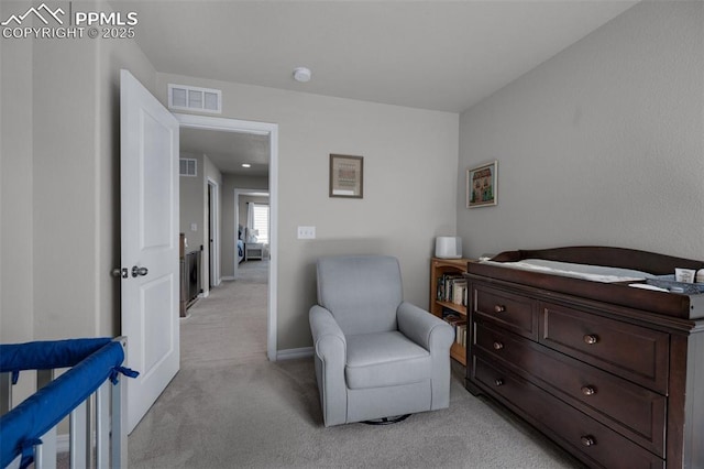 bedroom featuring visible vents, baseboards, and light colored carpet