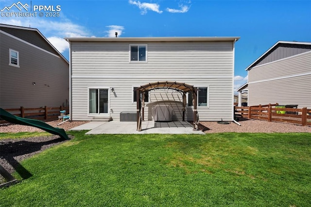 back of property featuring a fenced backyard, a patio area, a yard, and a pergola