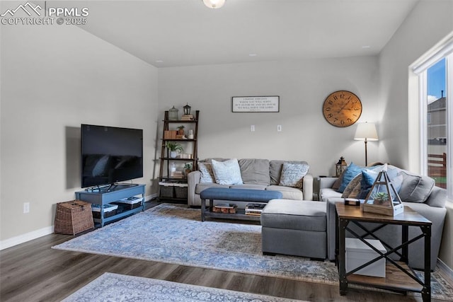 living room with baseboards and wood finished floors